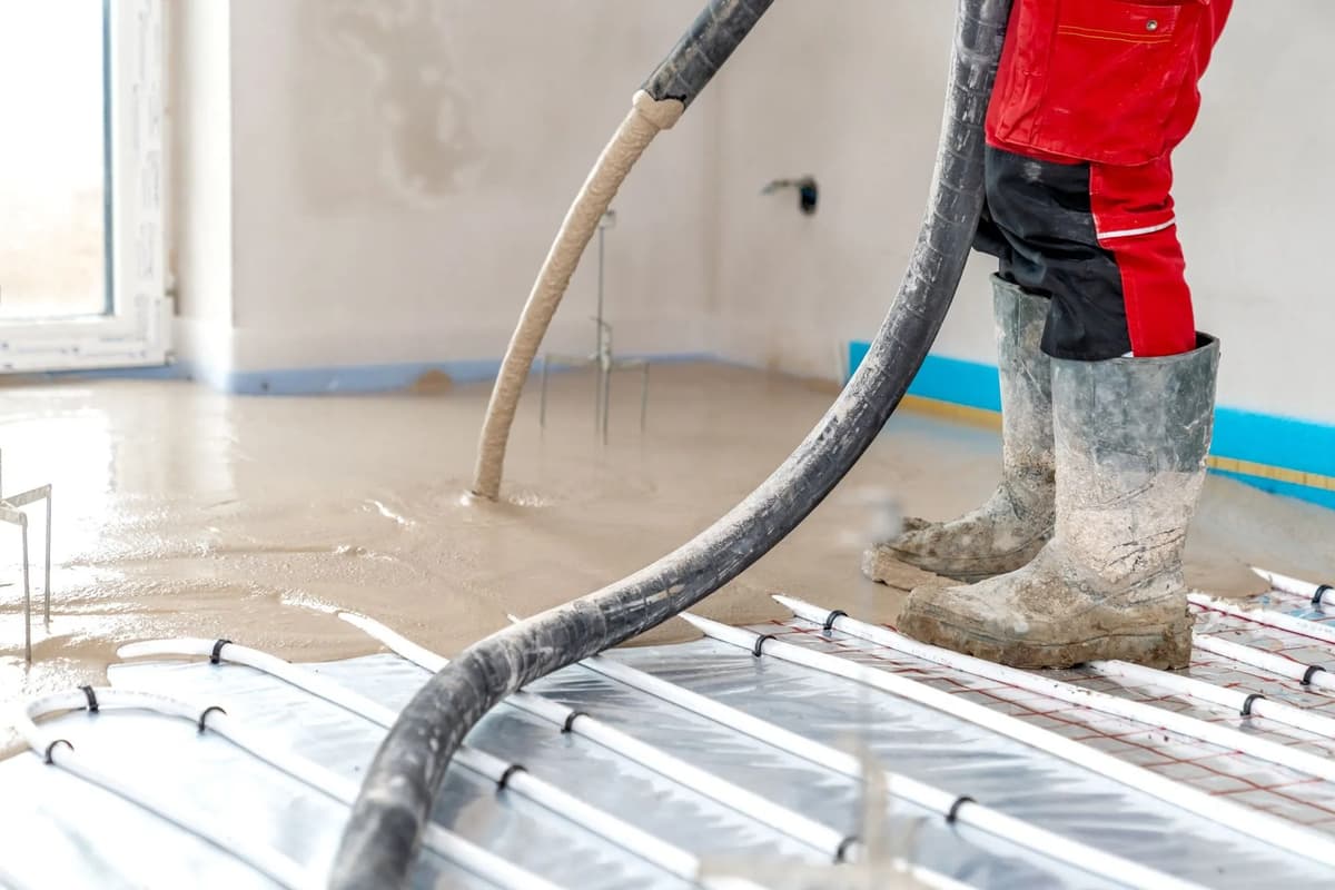 man pouring screed